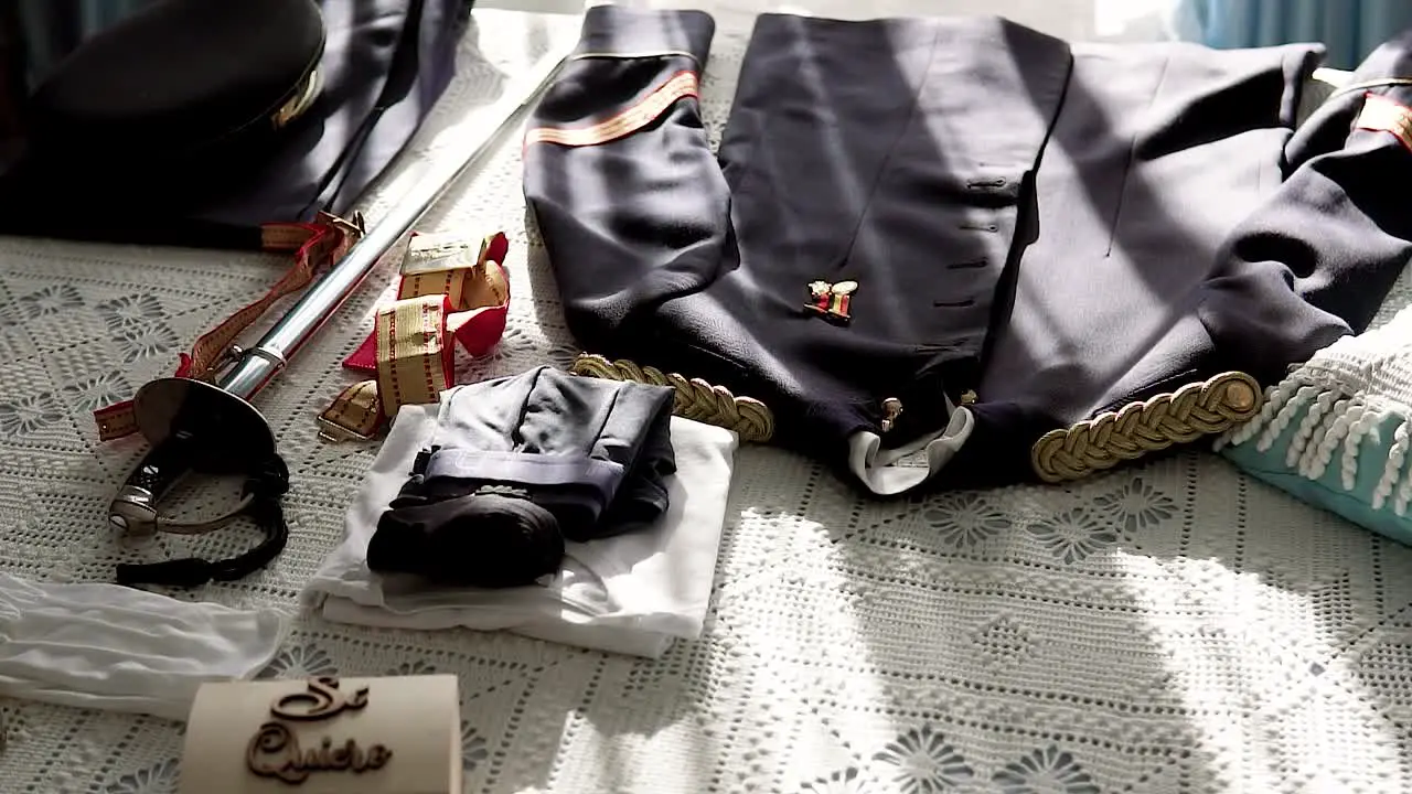 Military uniform with a sword prepared on a camera for a wedding