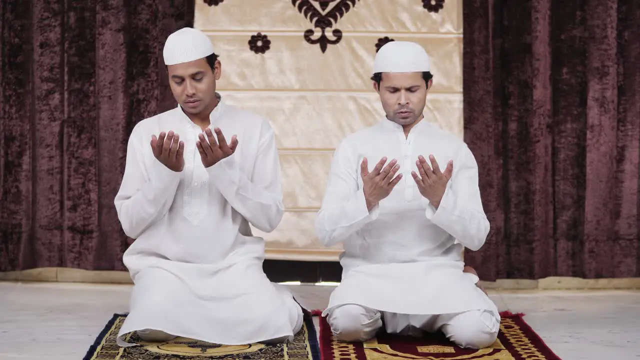 Muslim men doing rituals of Ramadan prayer