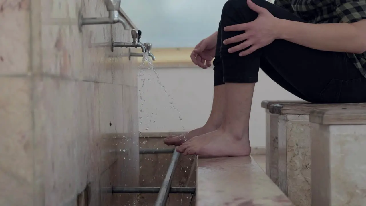 Young Muslim Man Taking Ablution For Prayer In Mosque 6