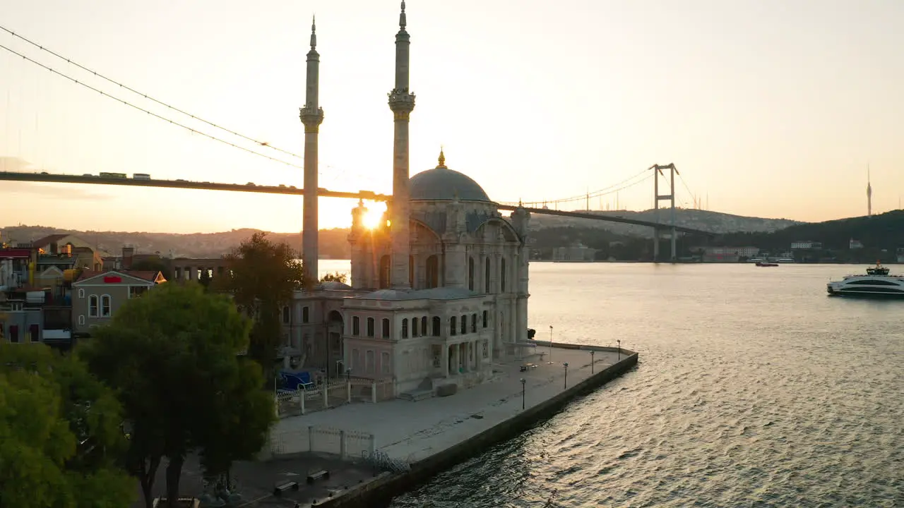 The Ortakoy Mosque at sunrise and the Istanbul bridge in the background