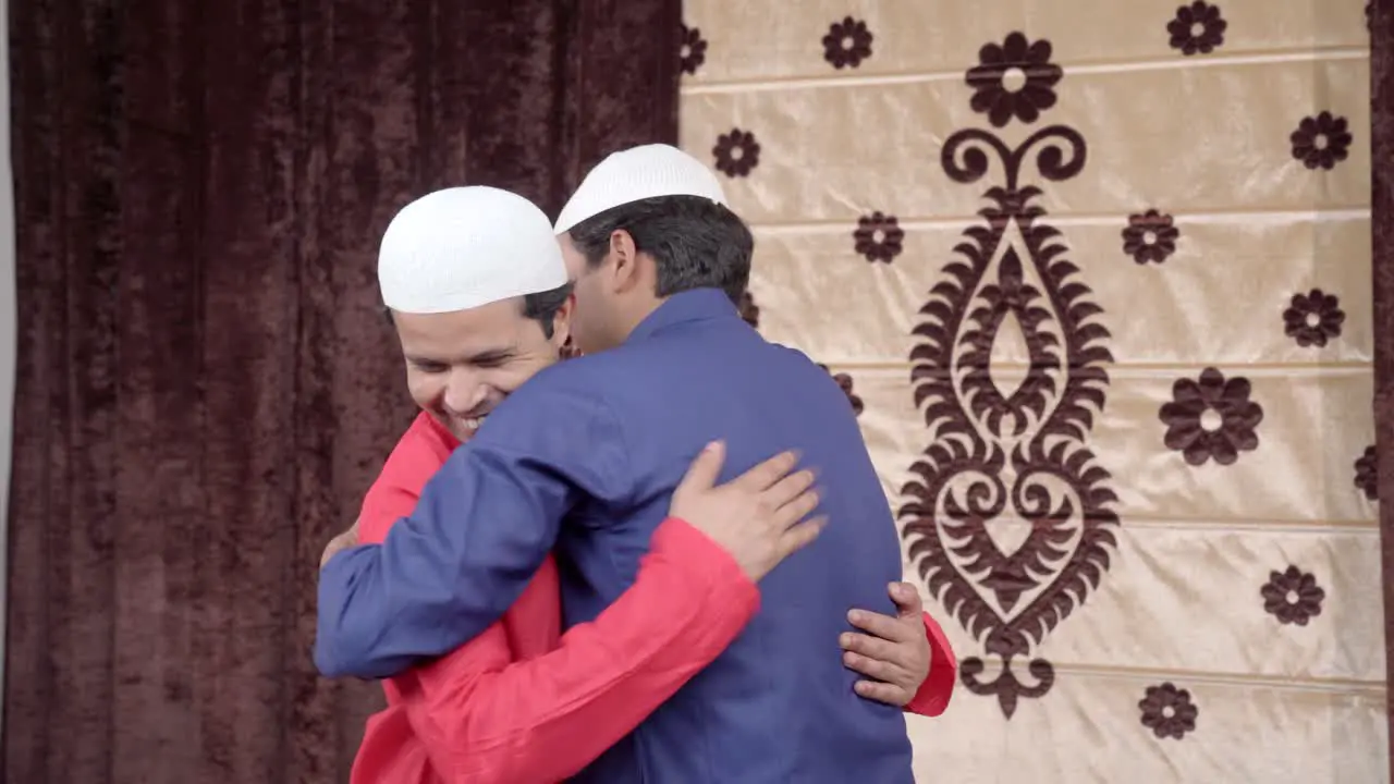 Muslim man congratulating his friend