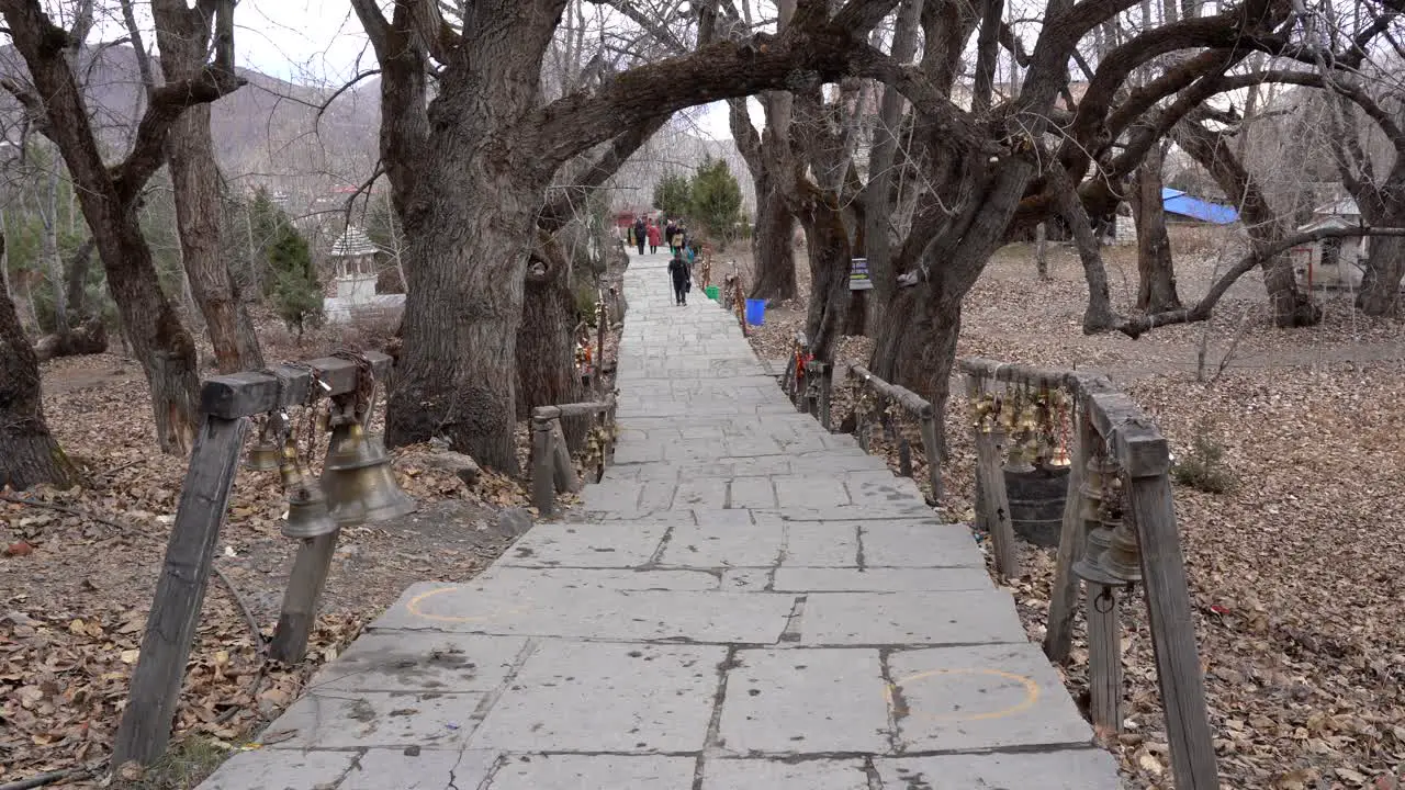 Muktinath Nepal November 20 2021 People walking on the path up to the Muktinath Temple in the lower Mustang Region of Nepal