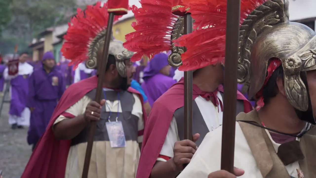 Young men dressed as Roman centurians march in an Easter procession in Antigua