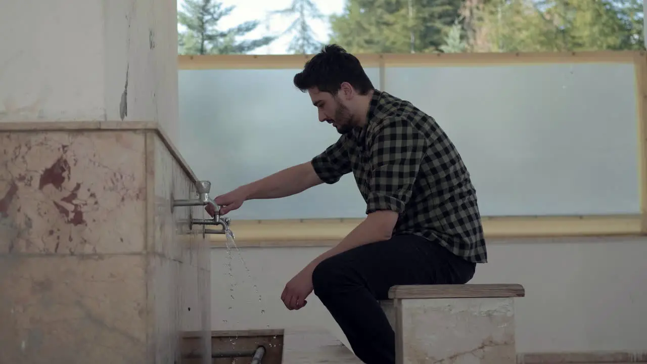 Young Muslim Man Taking Ablution For Prayer The Mosque 1