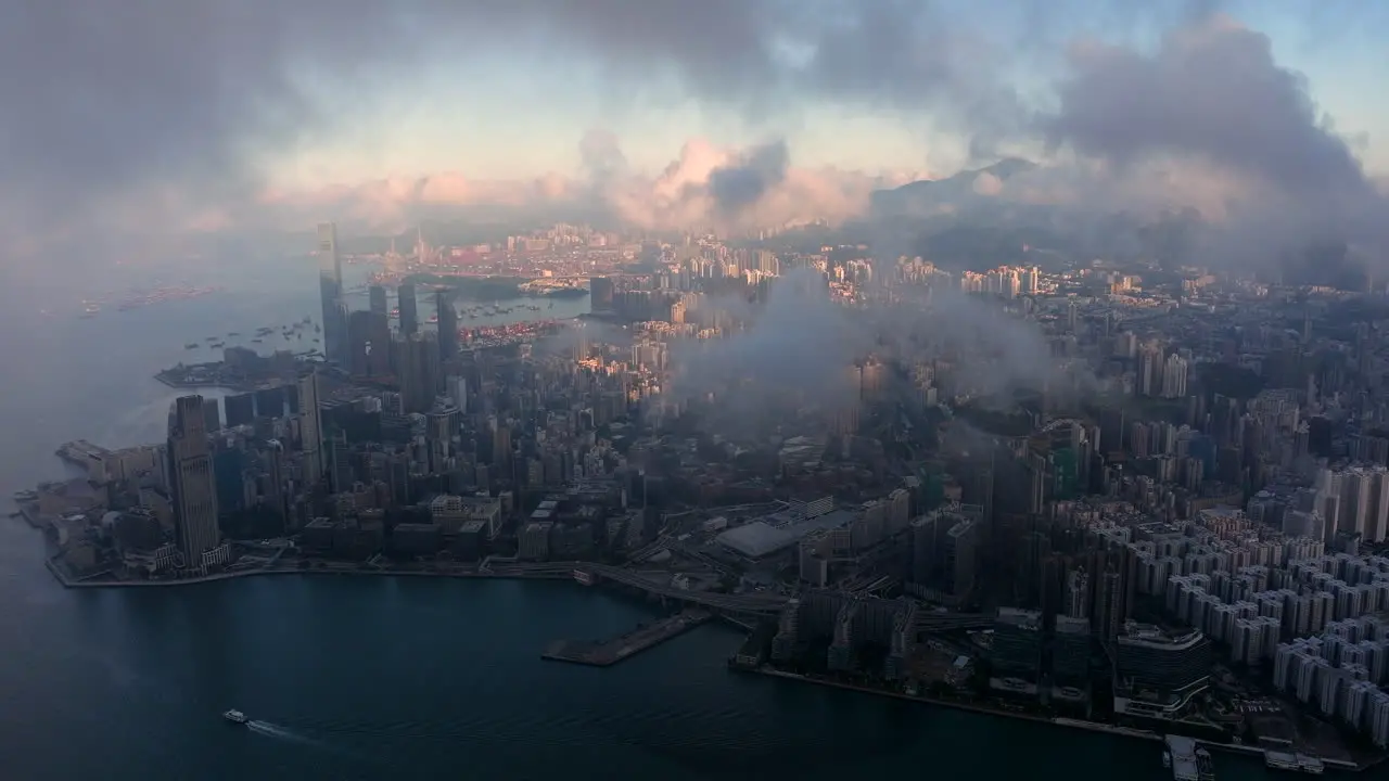 Beautiful Cinematic Establishing Shot Through The Moody Clouds over Kowloon Hong Kong City