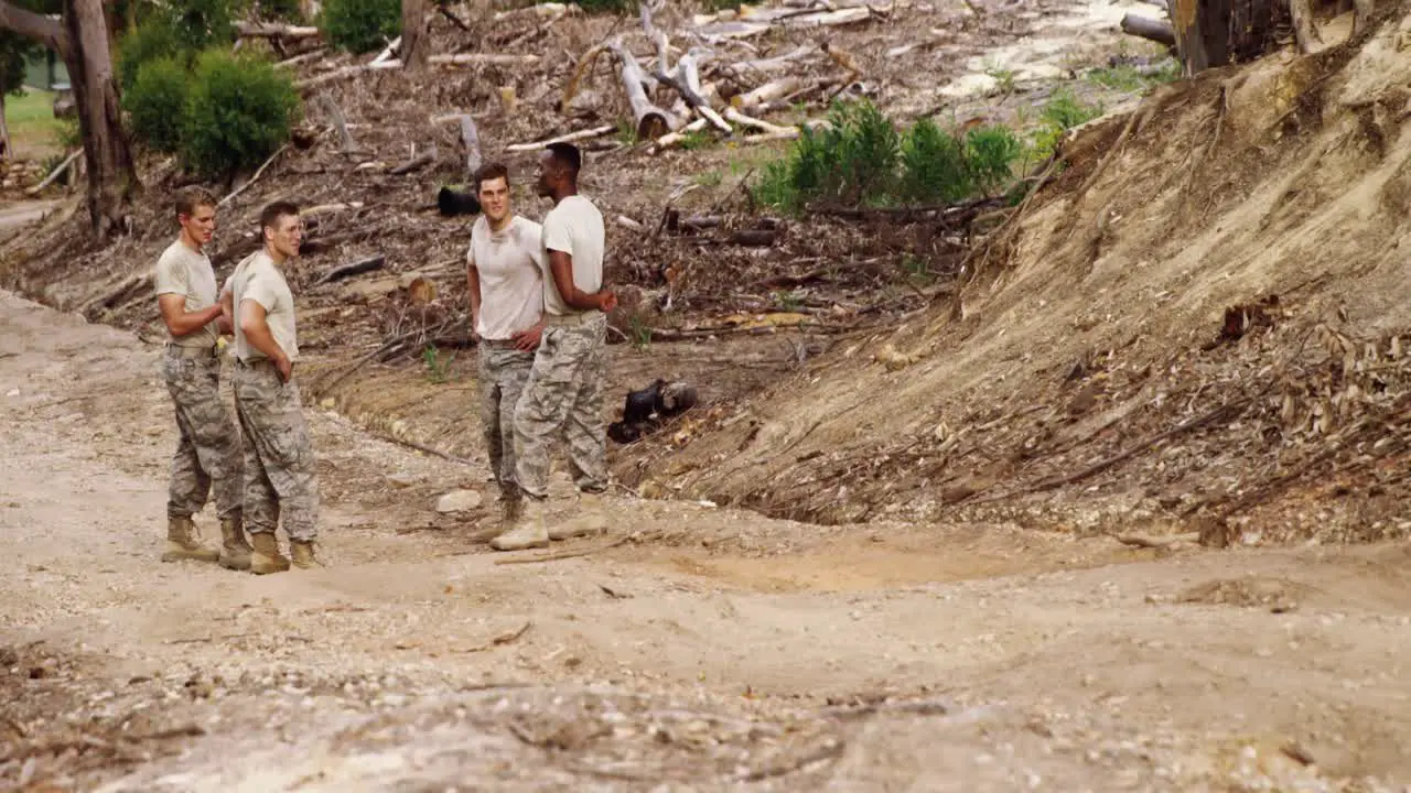 Military soldiers interacting with each other at boot camp 4k