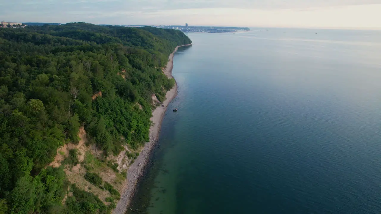 Charming drone flight over the cliff by the beach in Orlowo