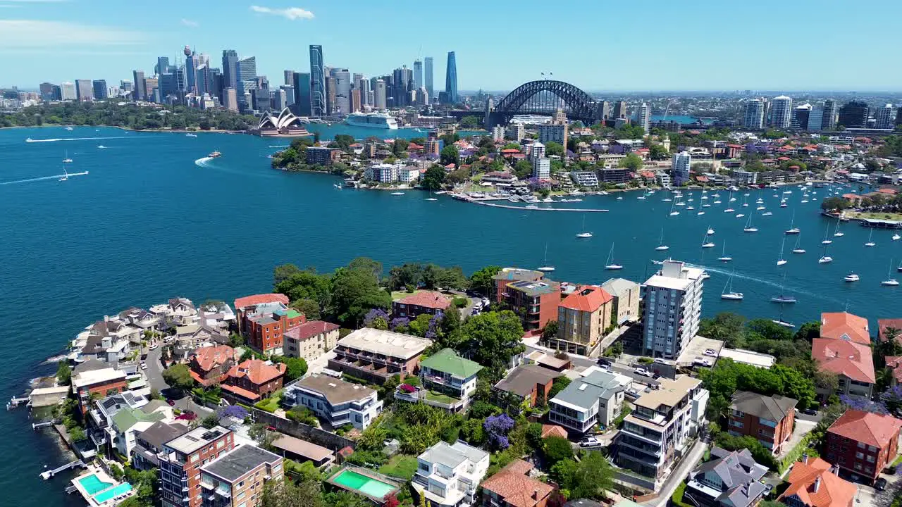 Drone aerial beautiful Sydney harbour CBD scenery city skyline Harbour Bridge Opera house residential unit apartments North Sydney Cremorne Neutral Bay Kirribilli NSW Australia travel tourism 4K