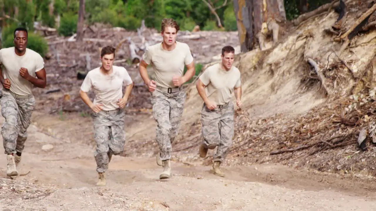 Military soldiers jogging at boot camp 4k