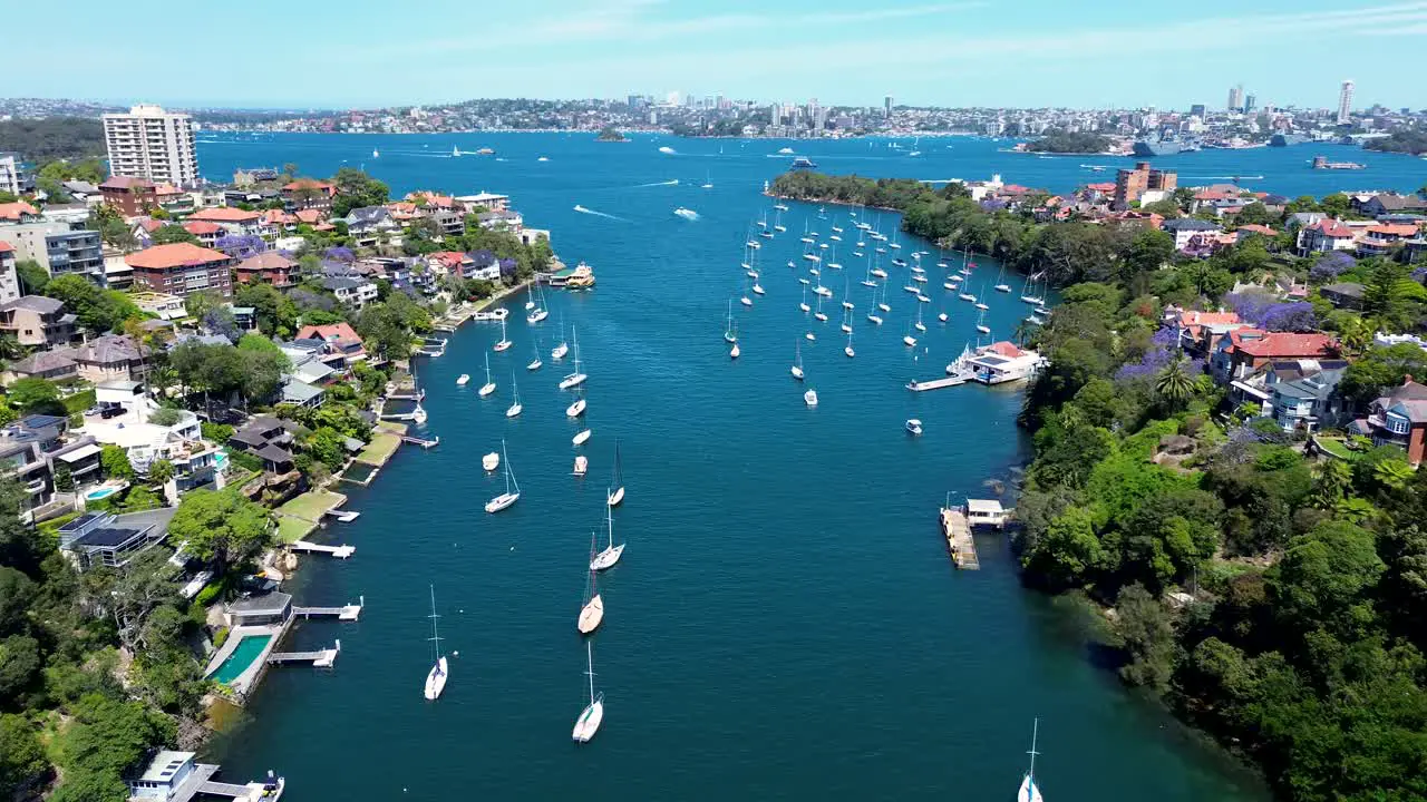 Drone aerial shot Mosman Bay Yachts boat dock ferry wharf Cremorne Point Neutral Bay North Sydney Bradleys Head Taraonga Zoo harbour residential housing apartments tourism CBD NSW Australia 4K