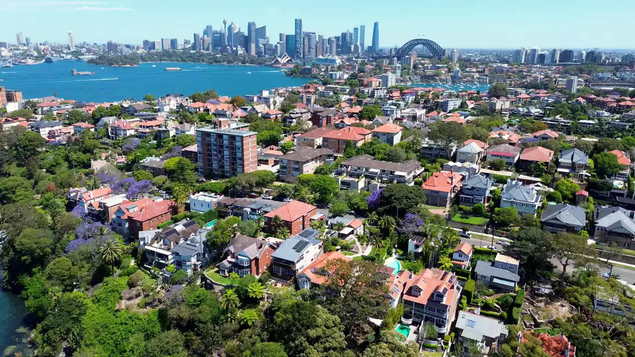 Drone aerial city skyline scenery Sydney harbour bridge sightseeing tourism housing residential apartments units urban metro Opera house Cremorne Point Neutral Bay Kirribilli NSW Australia 4K