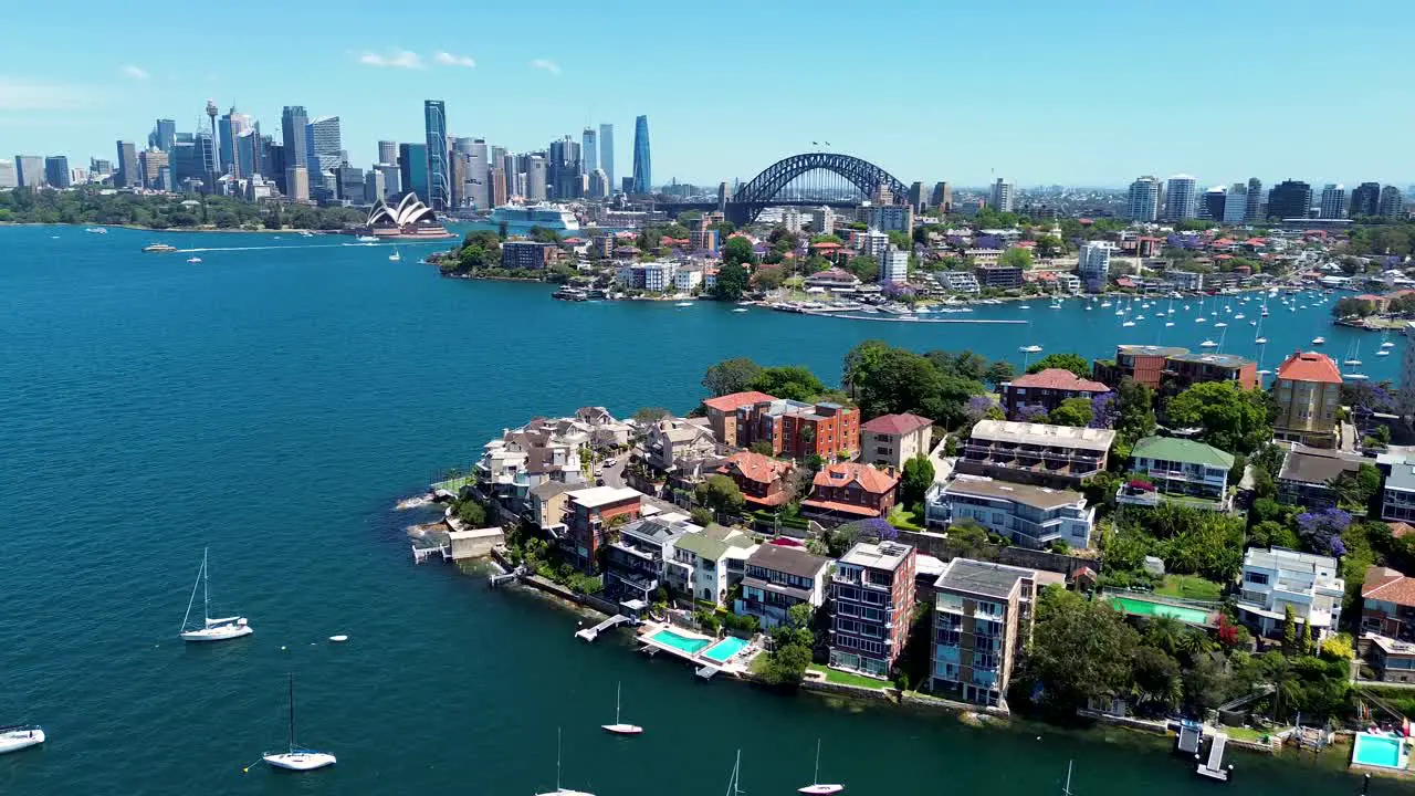 Drone aerial cityscape Sydney City CBD harbour bridge opera house from Cremorne Point Mosman Neutral Bay North Sydney apartments bay yachts sea NSW tourism travel Australia 4K