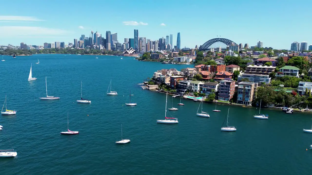 Drone aerial landscape scenic view Cremorne Point Neutral Bay Mosman Sydney City CBD skyline Harbour yachts apartment buildings real estate NSW Australia 4K