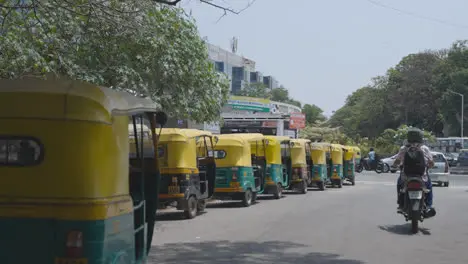 Line Of Auto Rickshaw Taxis Parked On Street In Bangalore India