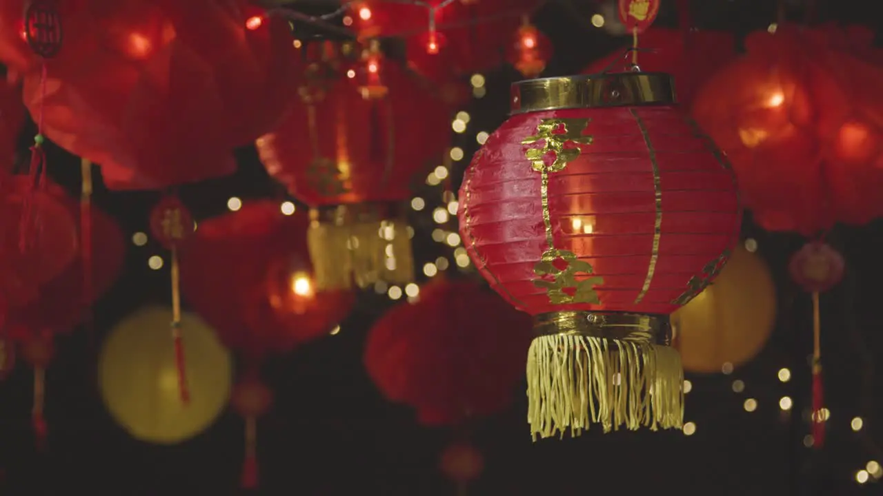 Studio Shot Of Colourful Chinese Lanterns Celebrating New Year Hung Against Black Background 2