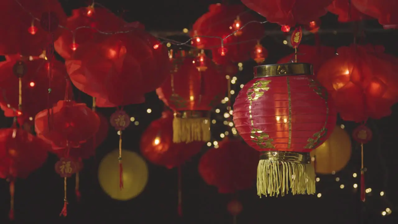 Studio Shot Of Colourful Chinese Lanterns Celebrating New Year Hung Against Black Background 3