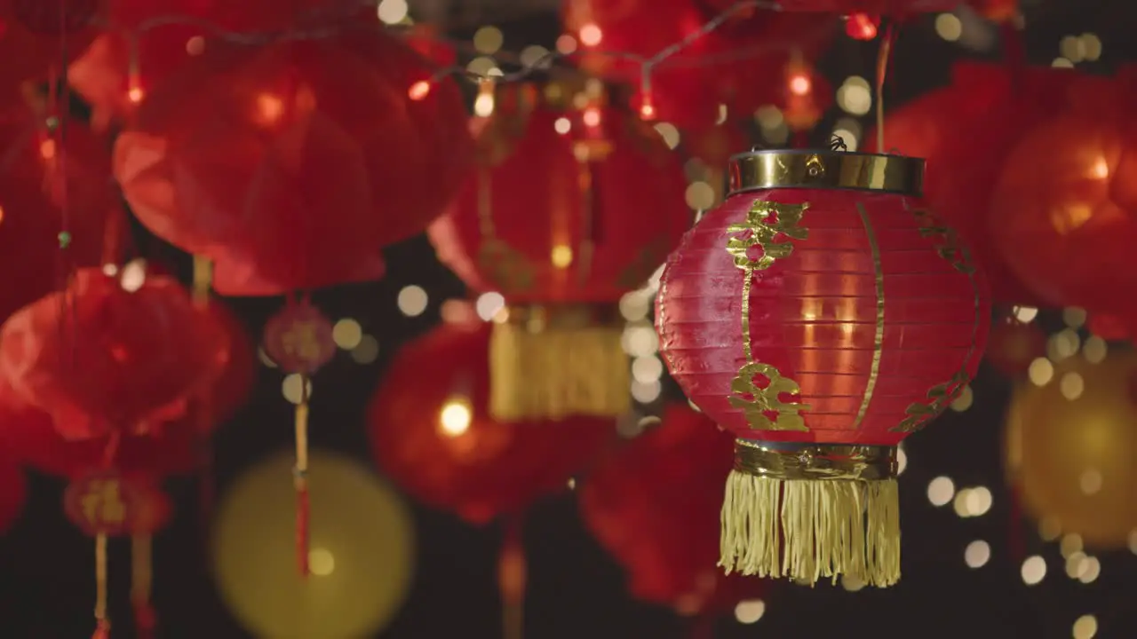 Studio Shot Of Colourful Chinese Lanterns Celebrating New Year Hung Against Black Background 5