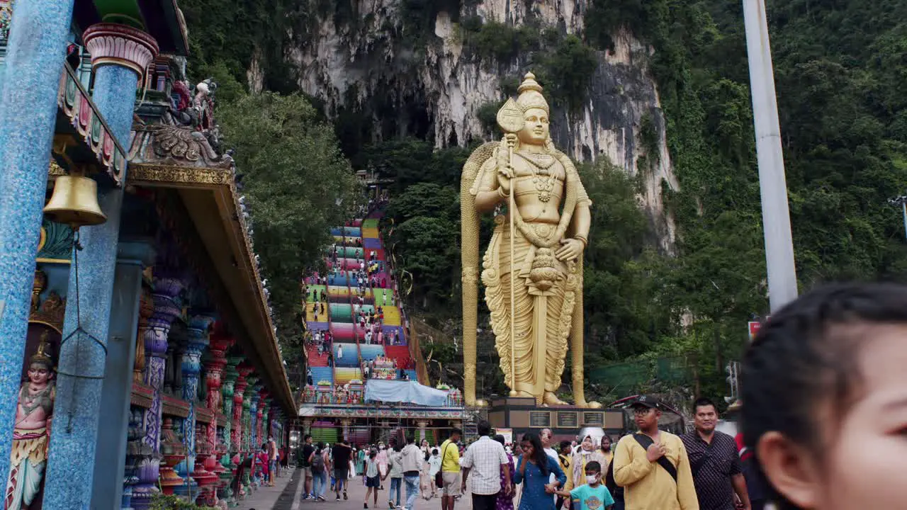 Tourists exploring Batu Caves Kuala Lumpur landmark