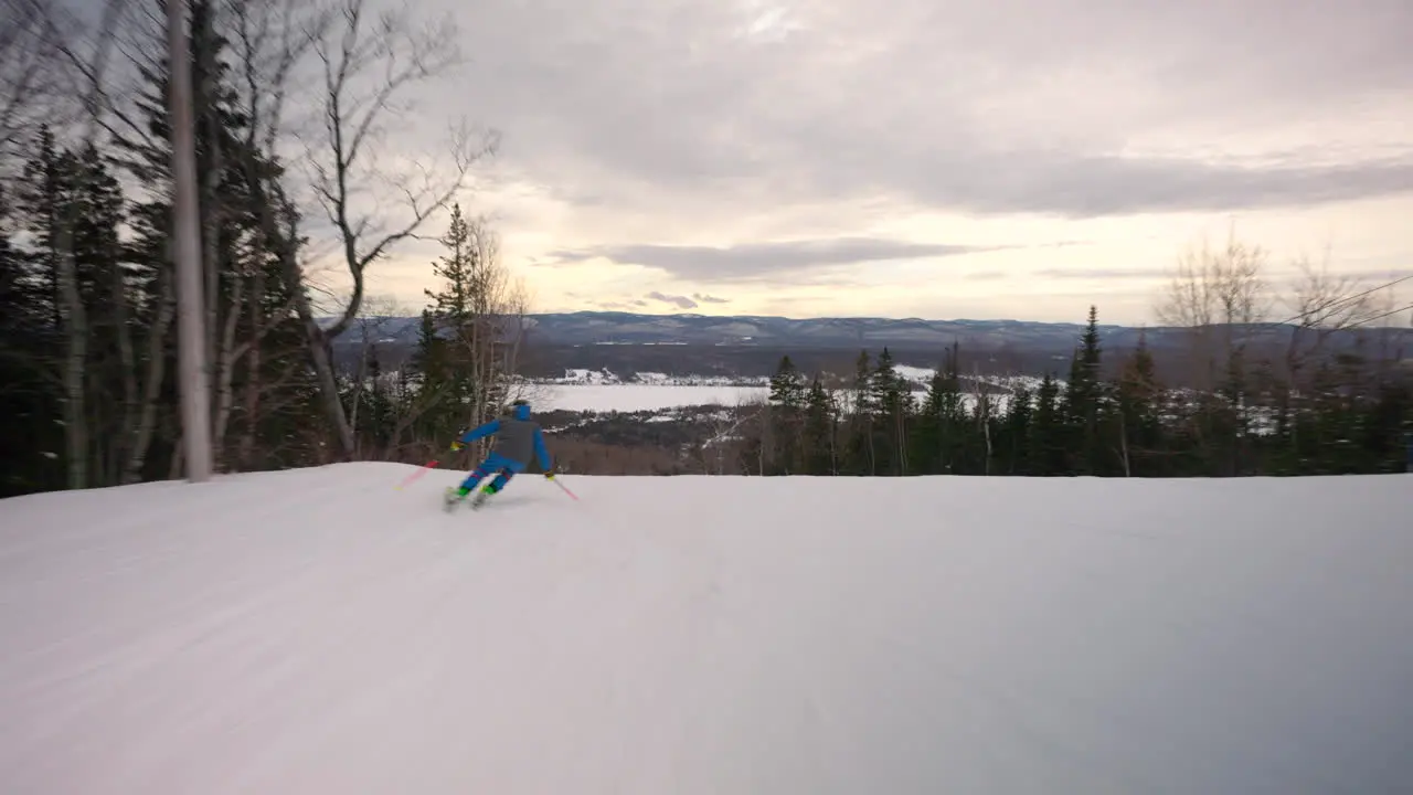 Downhill skier going down the slope