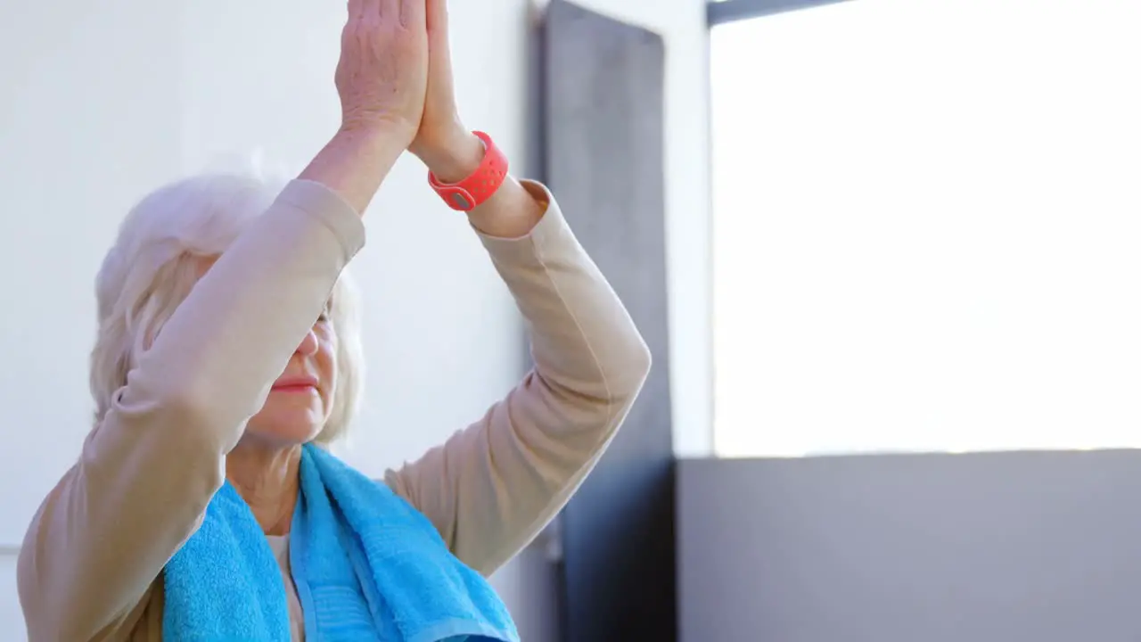 Senior woman performing yoga 4k