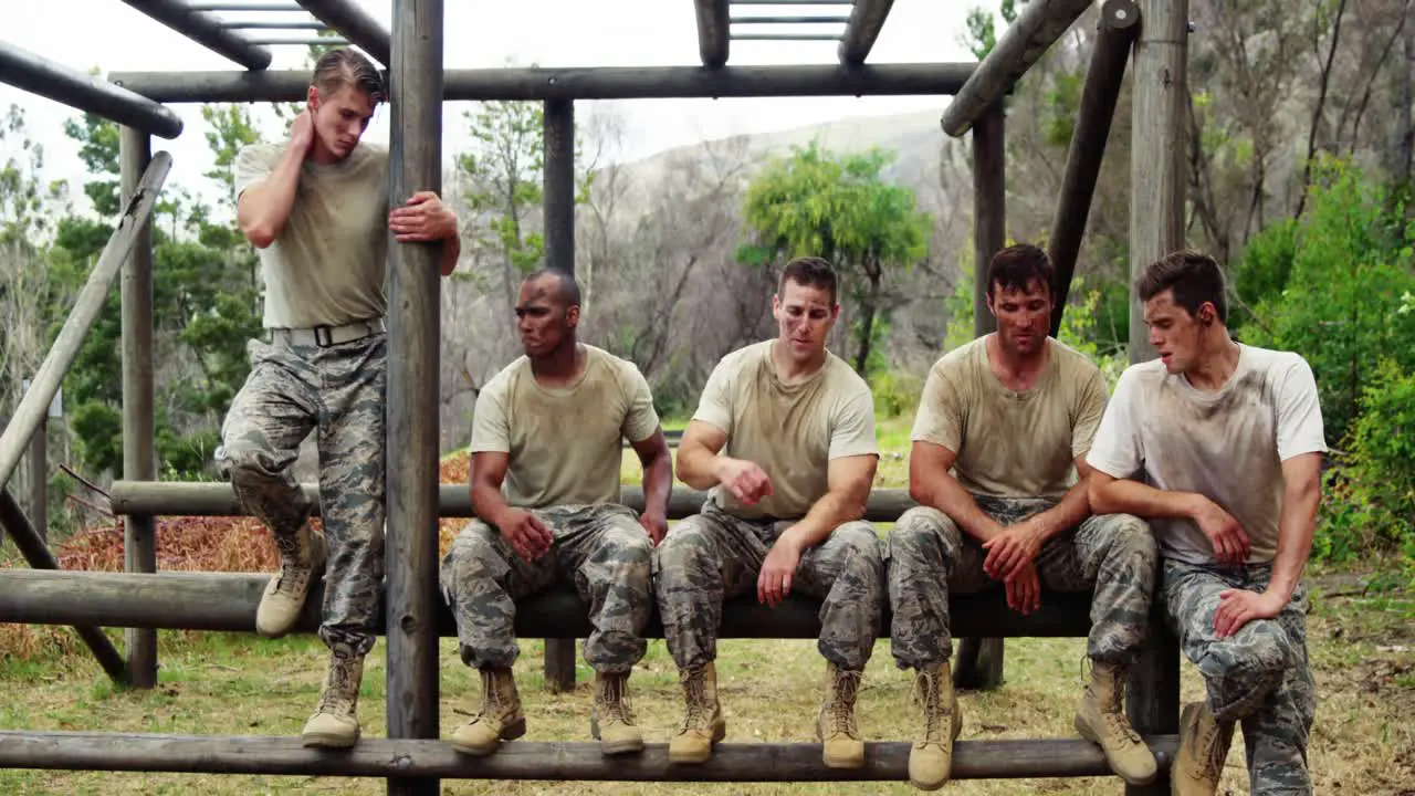 Military troops relaxing during obstacle course 4k