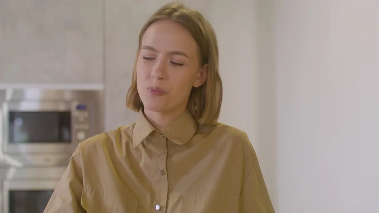 Pregnant Woman Sitting At Table Eating Fruit And Caressing Her Belly Coworker In Canteen