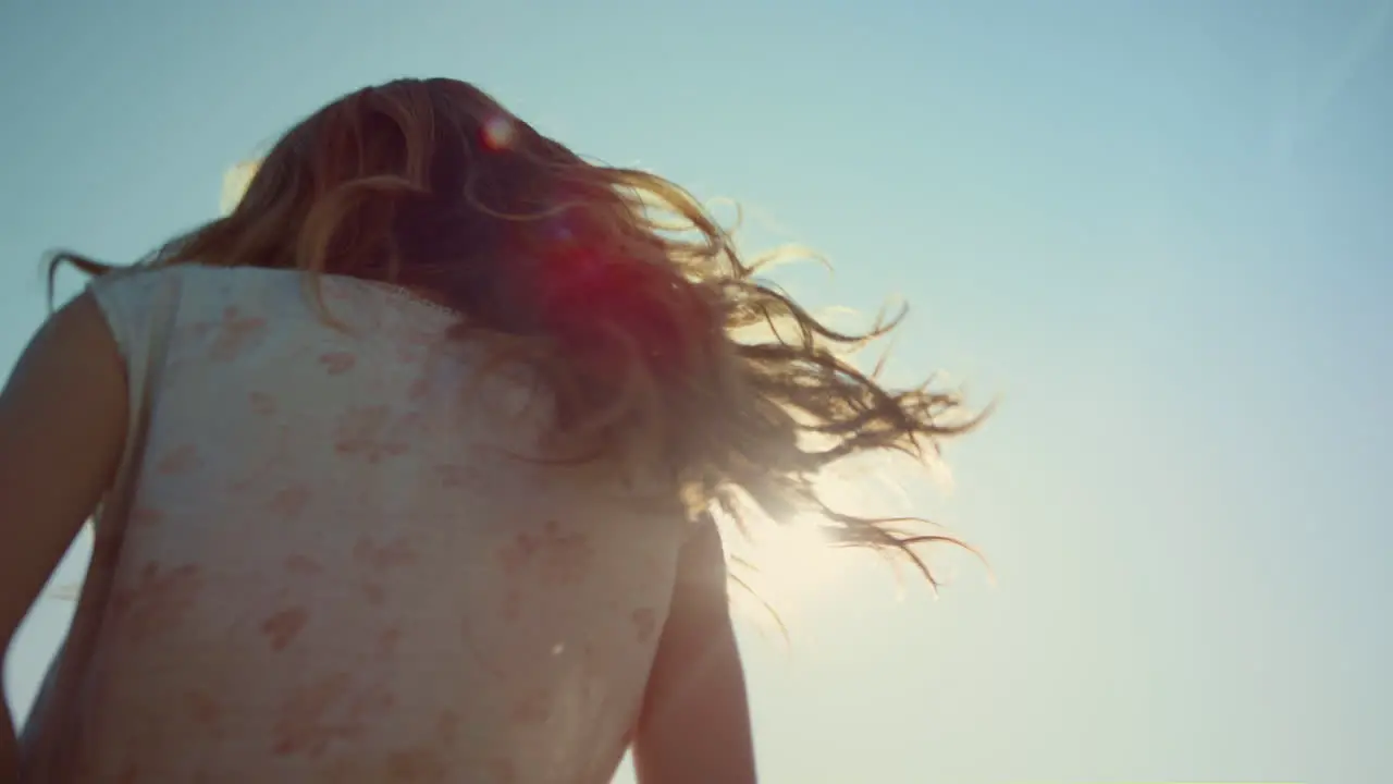 Closeup happy woman in love dancing in light outdoors Smiling woman in sunshine