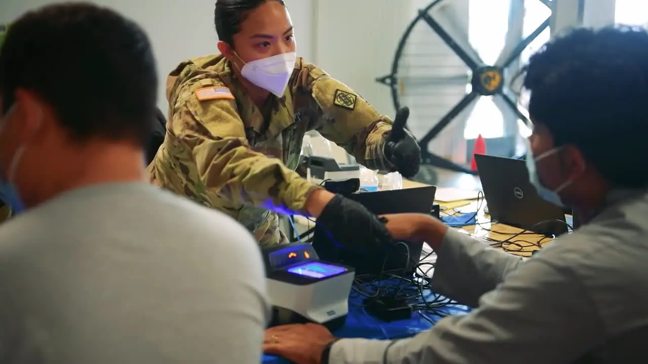 Us Army Soldiers At Ramstein Afb Screen Afganistan Evacuees During The Vetting Process During Operation Allies Refuge