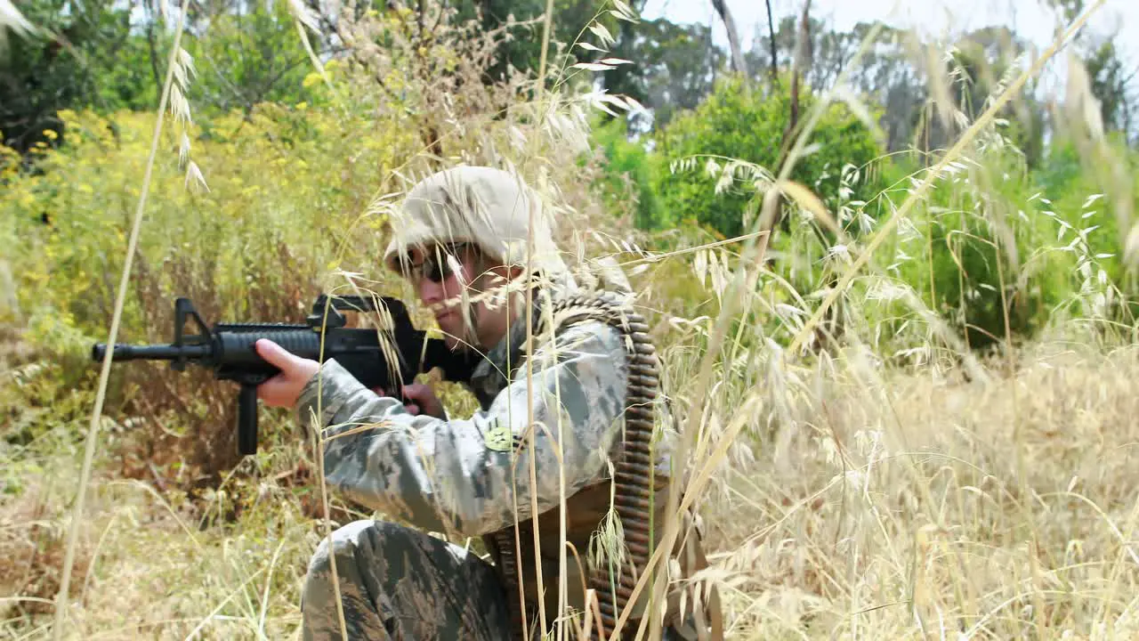 Military soldier guarding with a rifle