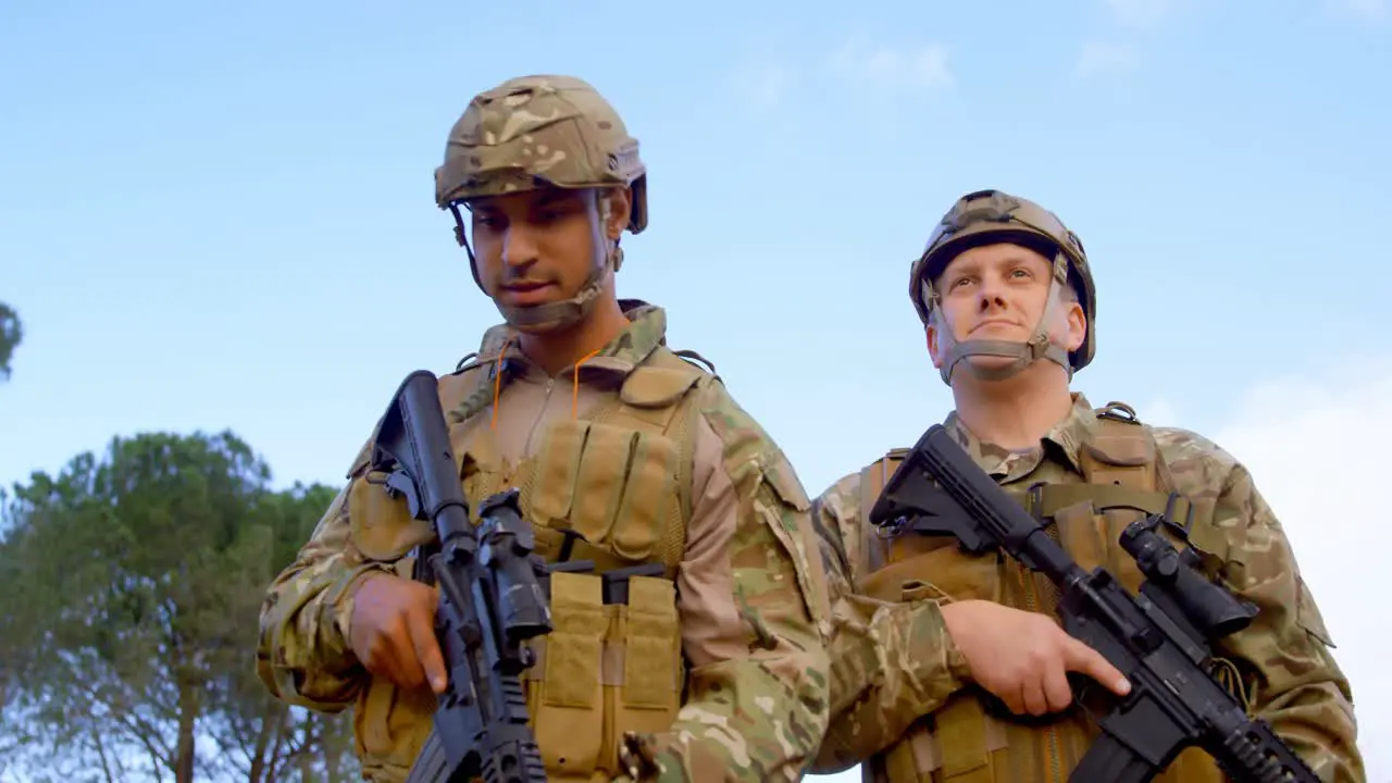 Low angle view of caucasian military soldiers rifle training in fields during military training 4k 