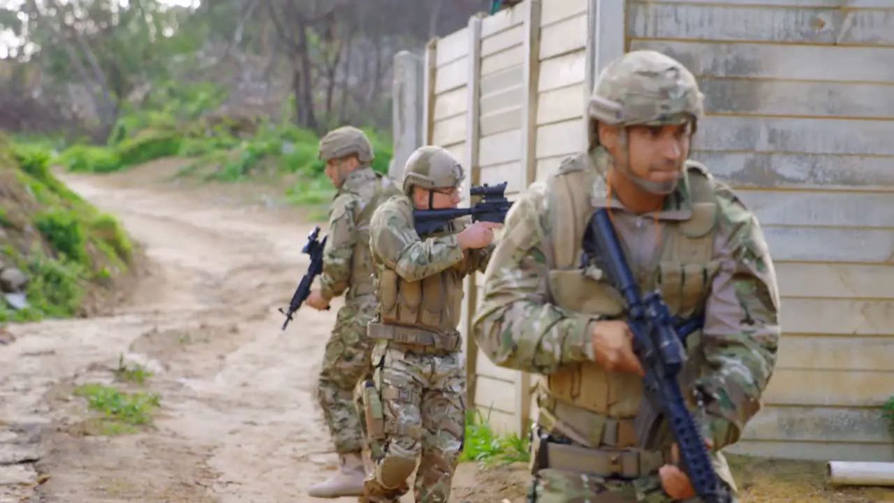 Front view of caucasian military soldiers rifle training in fields during military training 4k 