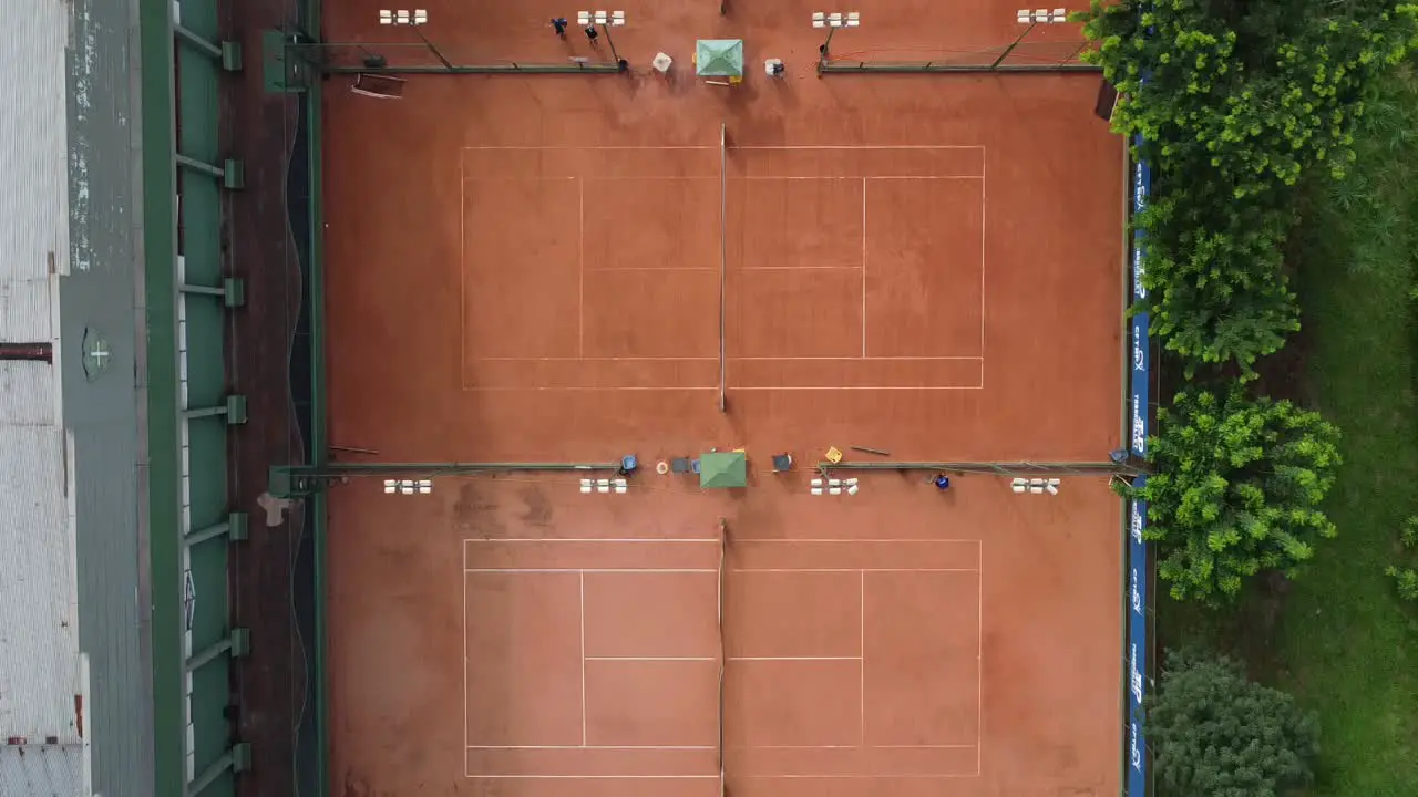 Bird`s Eye shot of 3 clay tennis courts