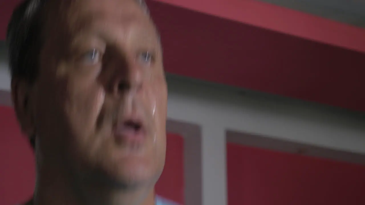 Sweat face of strong senior man running on treadmill