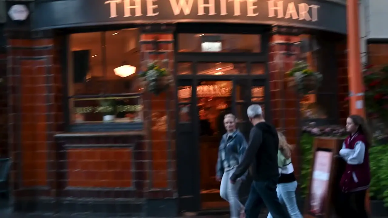 Walking past The White Hart pub London United Kingdom