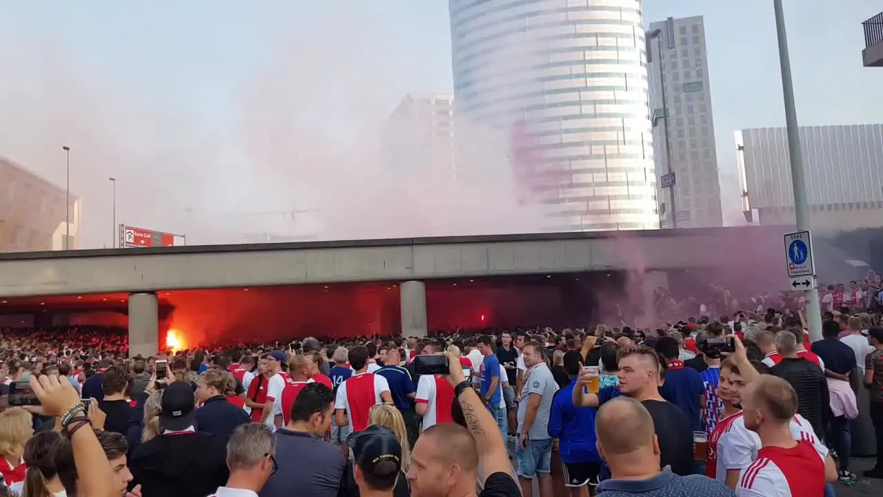 Ajax fans in streets singing and lighting up firework