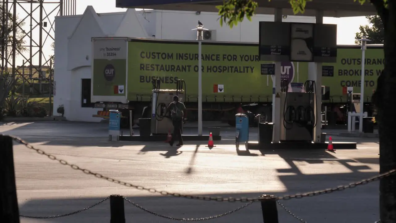 Commercial tandem truck pulls through petrol station in South Africa