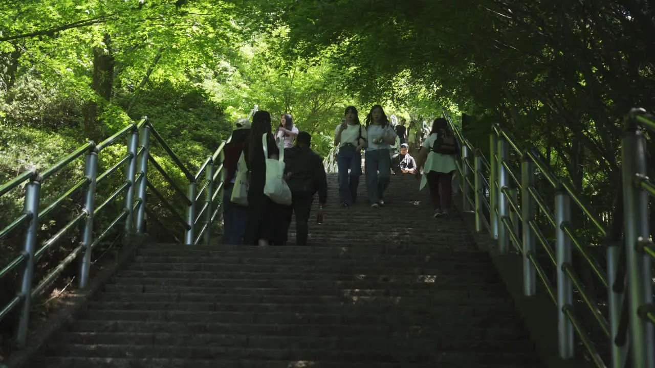 Tourists Climbing Stairs To Fujiyoshida Viewpoint