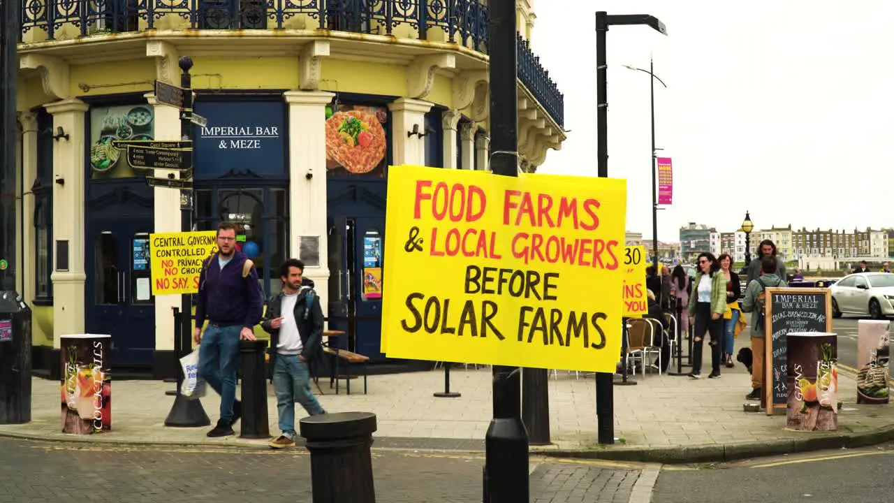 plenty yellow signs across the city to promote what the government and politics are preparing which is to control food by solar farms excluding organic food farms and local growers from the system