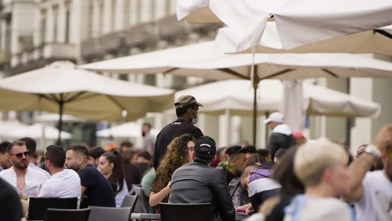 Slow motion scene of outdoor seating at cafe in Turin centre in Italy