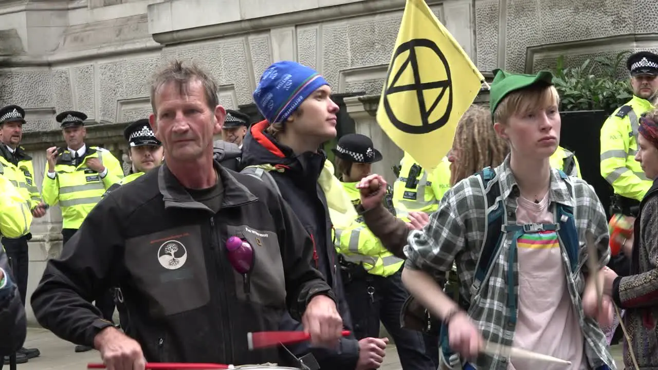 Extinction Rebellion protesters play music near Westminster in central London UK