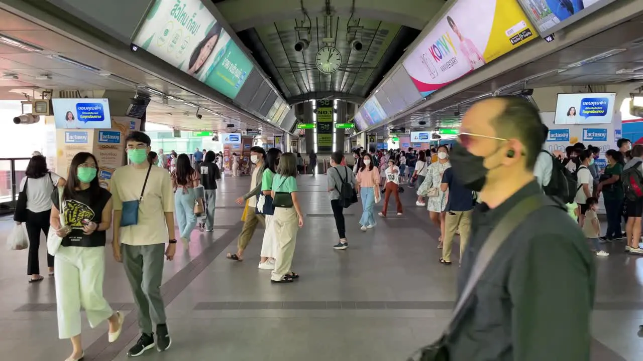 Tourists and commuters at Siam BTS station  main interchange public transport of Bangkok city