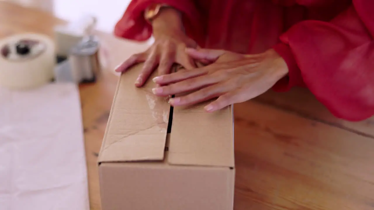 Woman hands and box package and tape