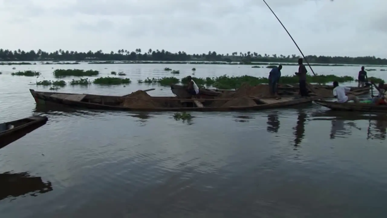 Boats transporting sand River sand mining in Nigeria