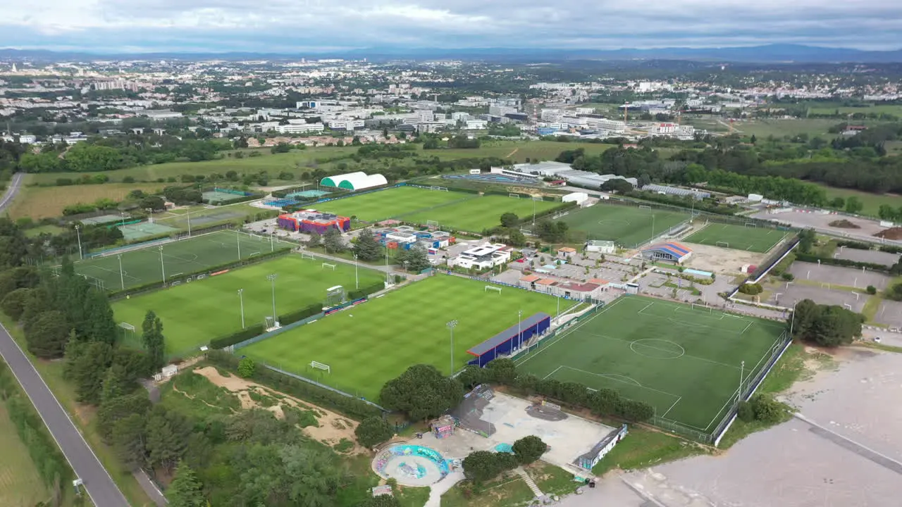 Football fields in Montpellier aerial large view green grass soccer fields cloud