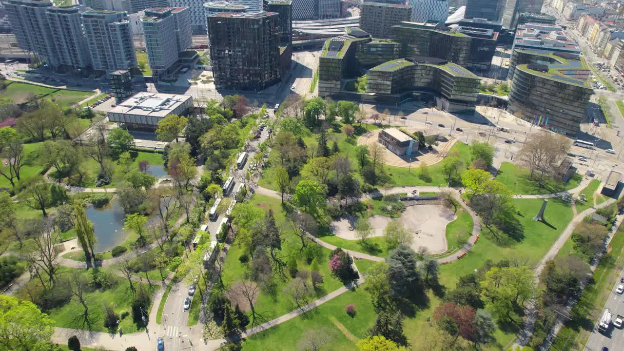 Drone flight over Vienna Austria main station business district Sonnwendviertel and Swiss Garden Park