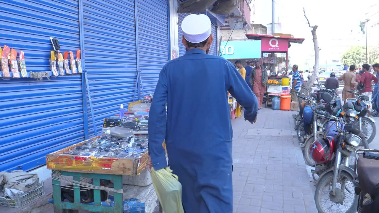 Cinematic shot of small roadside stalls near in Saddar Bazar Street during daytime in Karachi  Pakistan