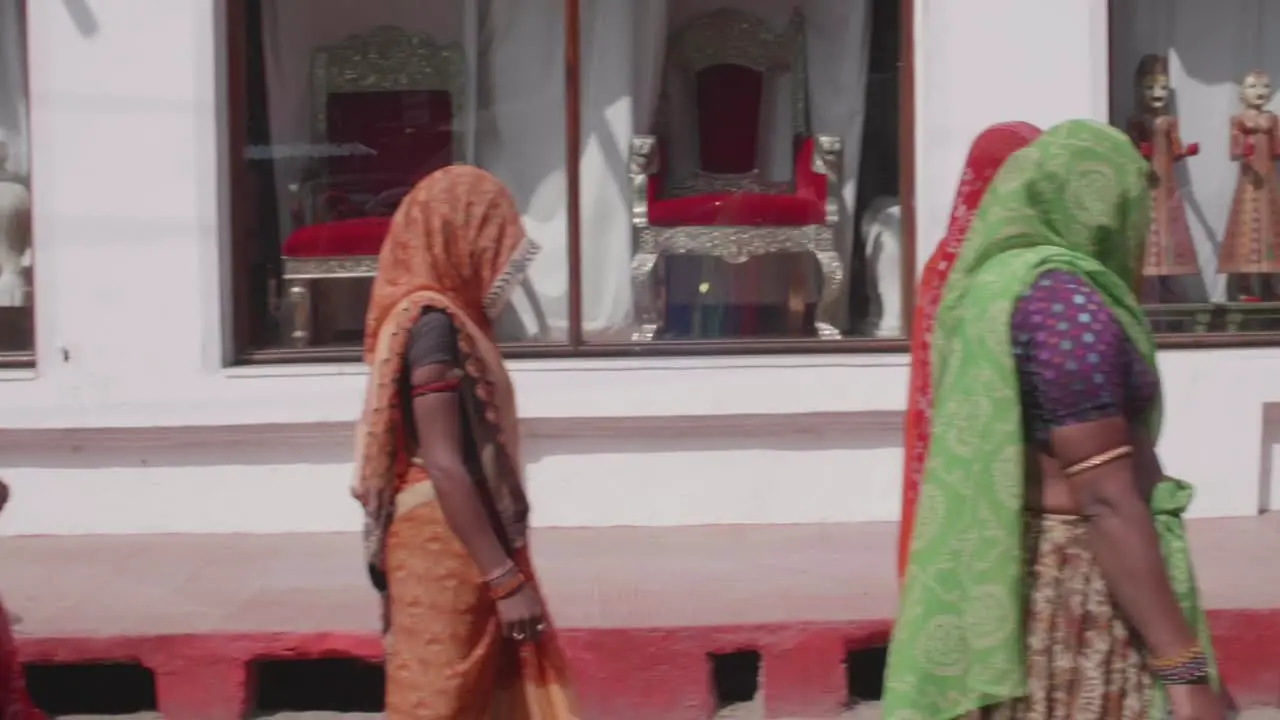 Crowd of Indian women and their children walking together