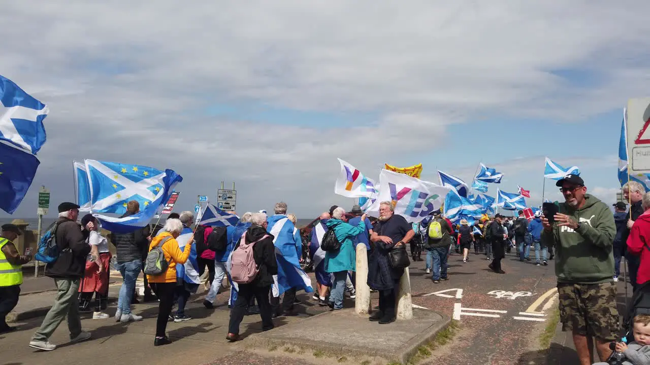 People marching for Scottish Independence on a windy day