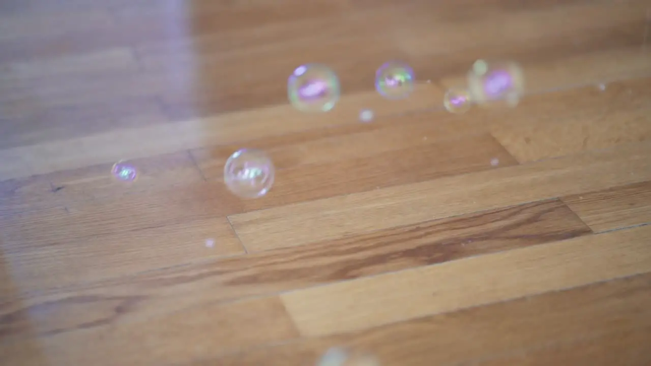 Corona Bubbles Popping Out Of The Wooden Floor Signifying Footsteps Of People That Had Close Physical Contact With A Covid-19 Person close up