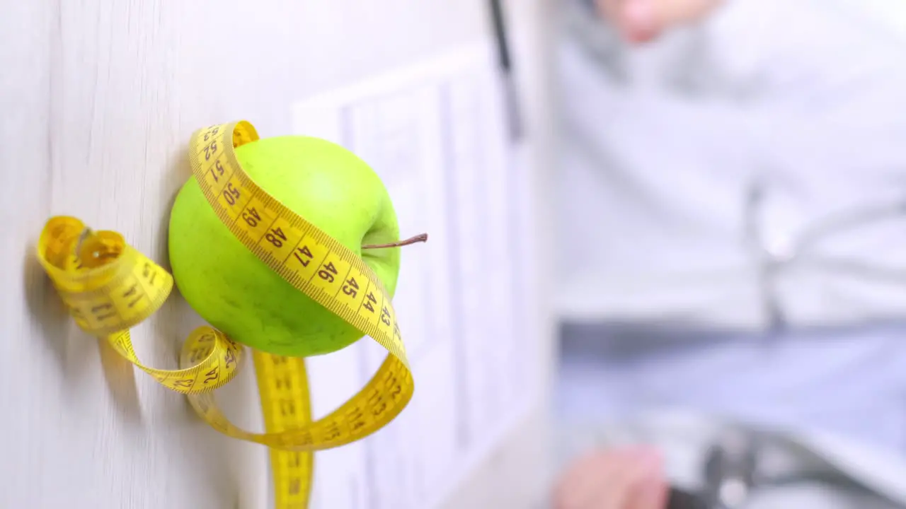 Vertical video of Apple and Measure tape in Focus Doctor using Smartphone in Blurred background